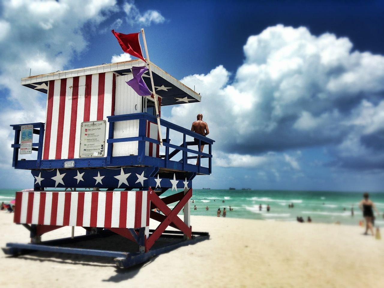 Lifeguard tower with safety flag on the beach